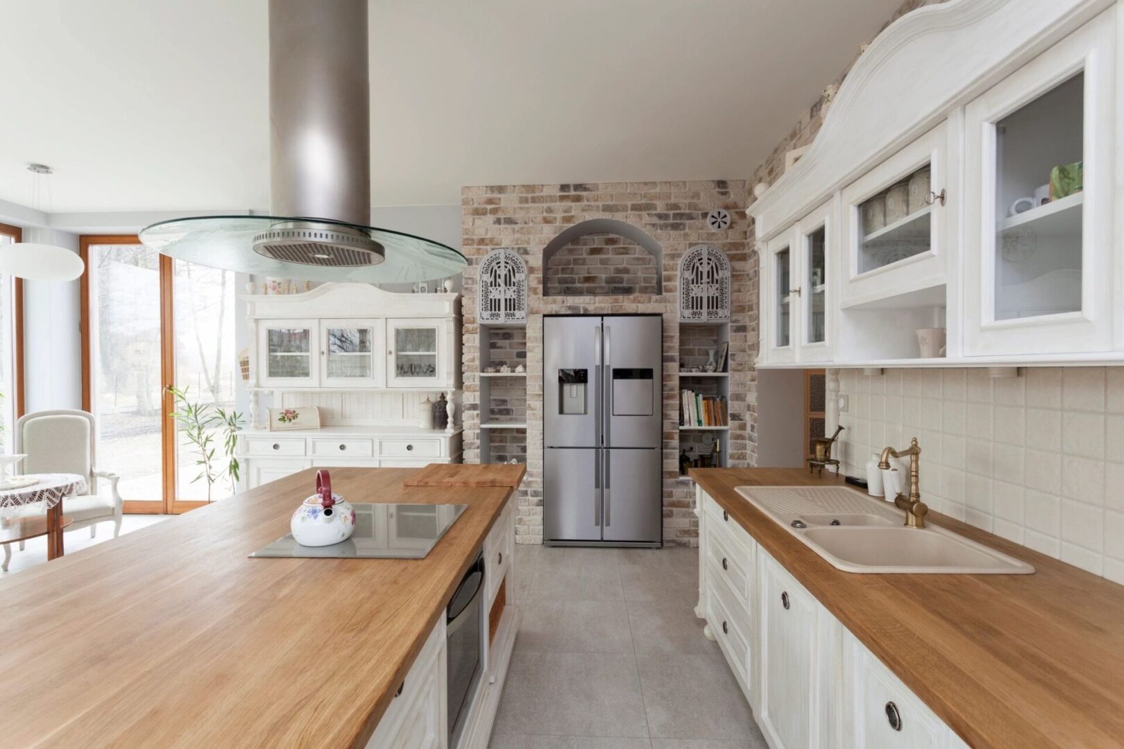 Modern kitchen with stainless steel fridge.