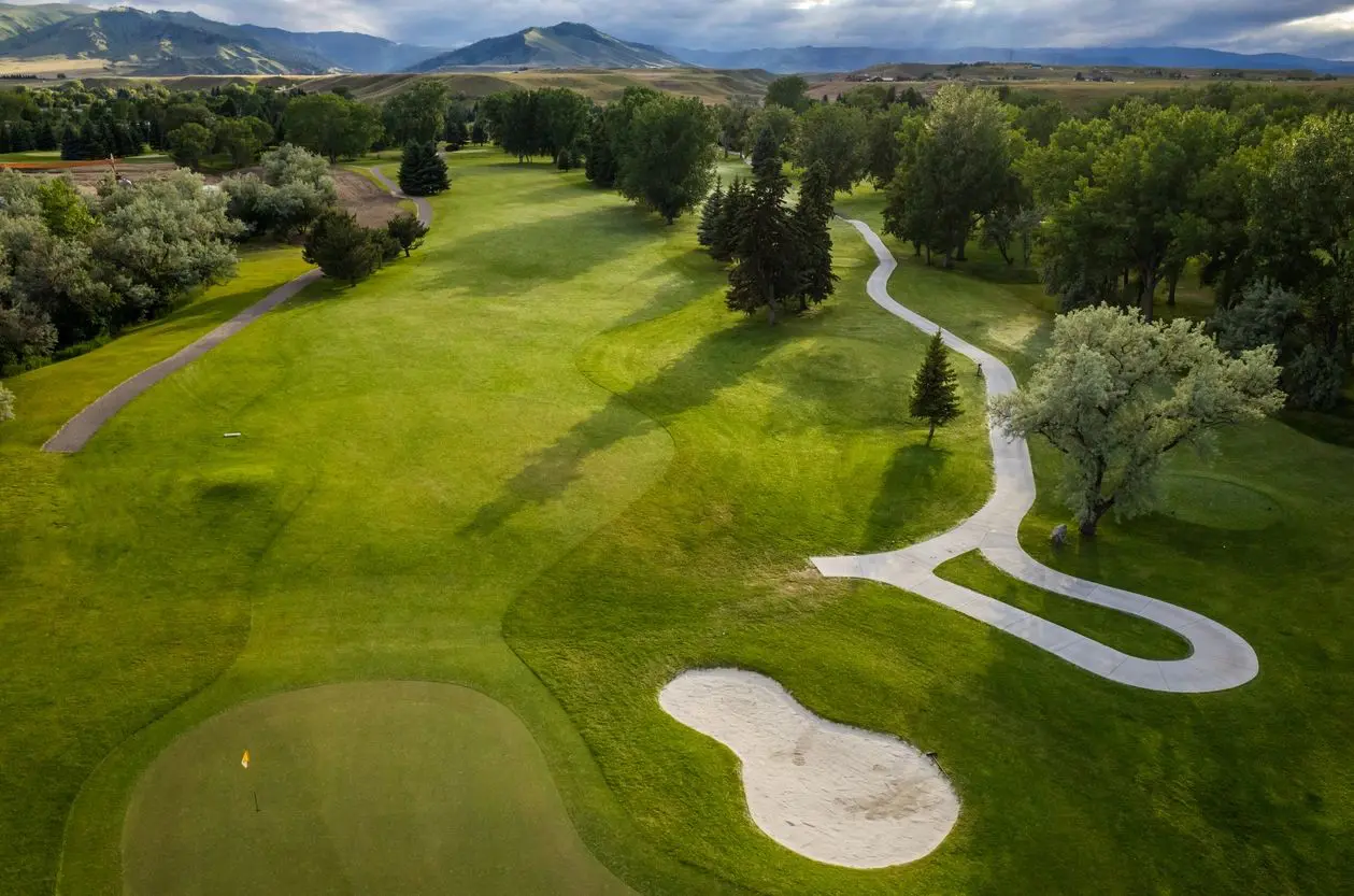 Aerial view of golf course with sand trap.